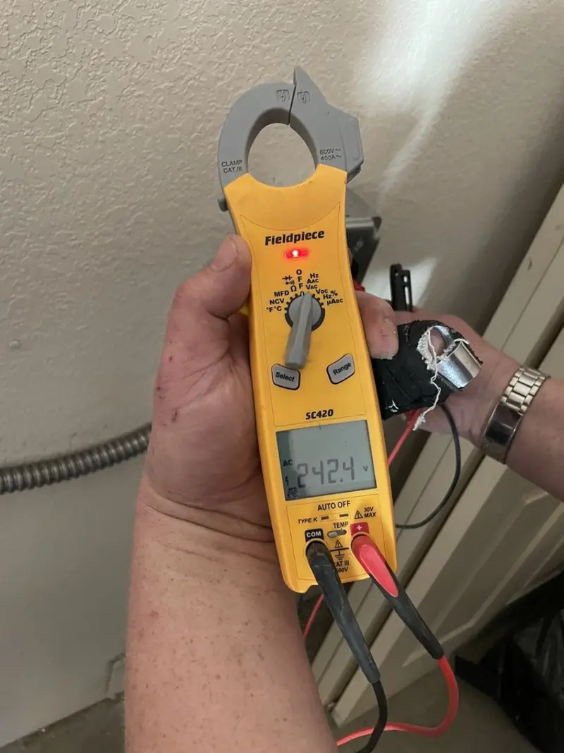 Voltage testing with clamp meter during Electrical Installation Services in Parkland